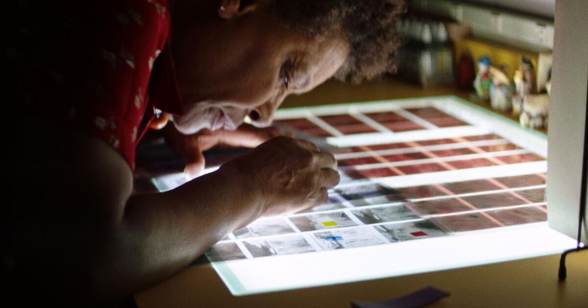 Picture of a woman looking at film reels