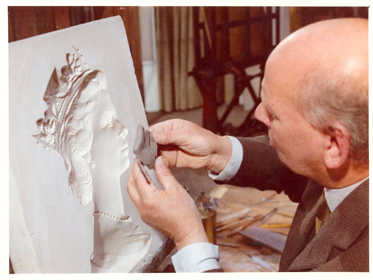 Machin taking a clay impression of the plaster cast’s head. © Royal Mail, courtesy of The Postal Museum.