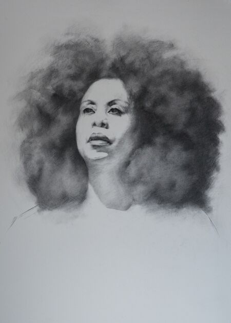 A reecent portrait drawing done with a soft vine charcoal stick