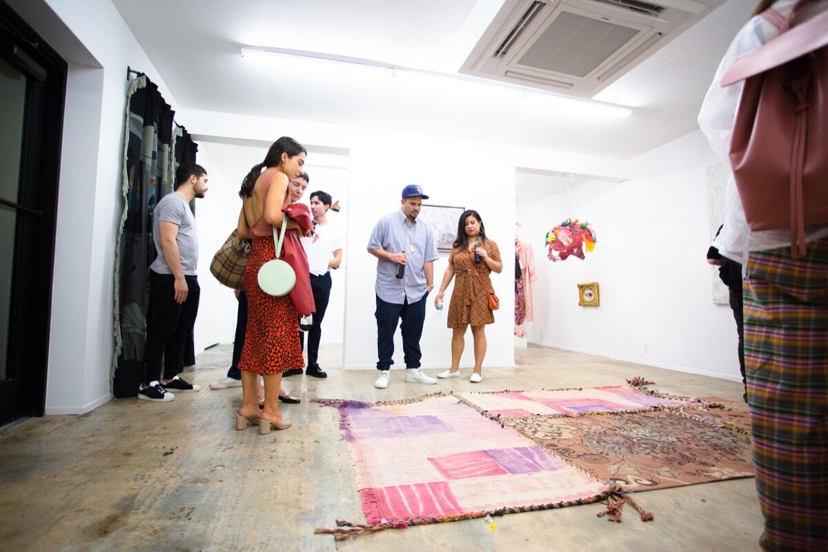 Guests in the downstairs gallery of Nina Johnson for the opening of &quot;Of Purism&quot; curated by Charlap Hyman and Herrero. Courtesy Nina Johnson.