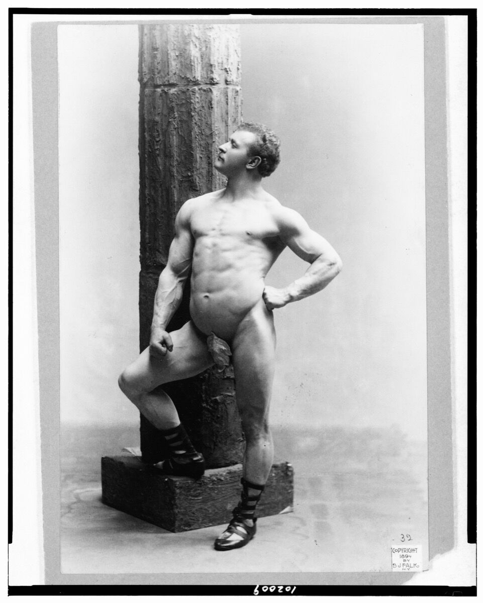 B.J. Falk, Eugen Sandow, full-length nude portrait, standing by column, facing left, 1894.