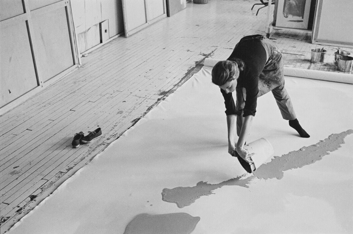 Helen Frankenthaler at work on a large canvas, 1969. Photo by Ernst Haas. Ernst Haas/Getty Images