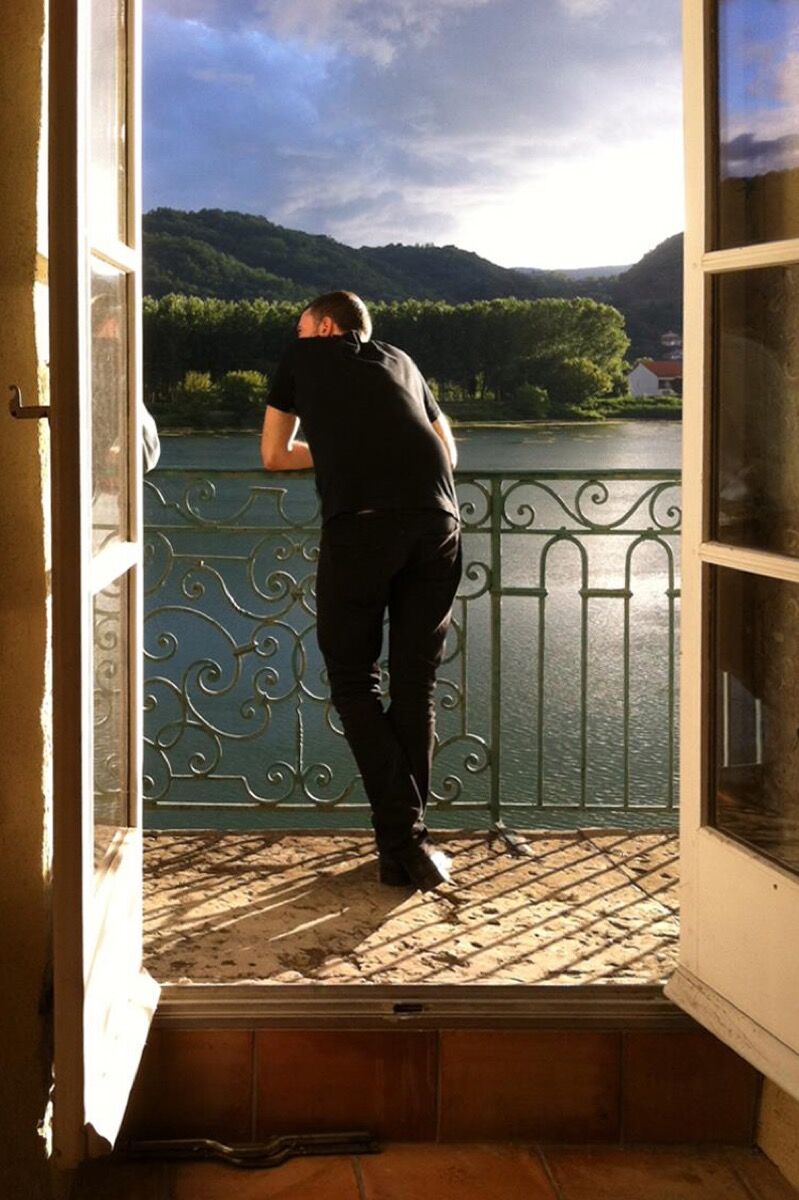 Artist Jean-Baptiste Bernardet at the balcony of his studio at Moly-Sabata, July 2014. Courtesy of Moly-Sabata. 