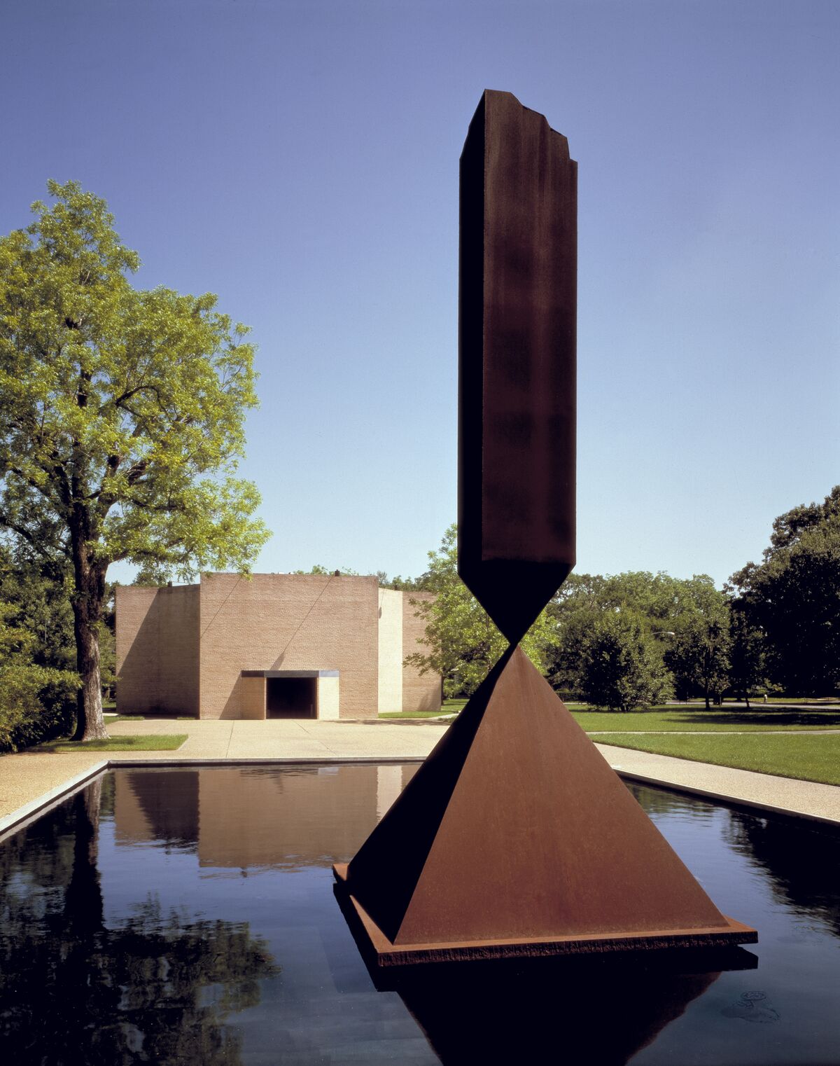 Barnett Newman, Broken Obelisk, 1963-1967, dedicated to Martin Luther King, Jr., in front of the Rothko Chapel (1971). Photo by Hickey-Robertson. Courtesy of the Rothko Chapel Archives.