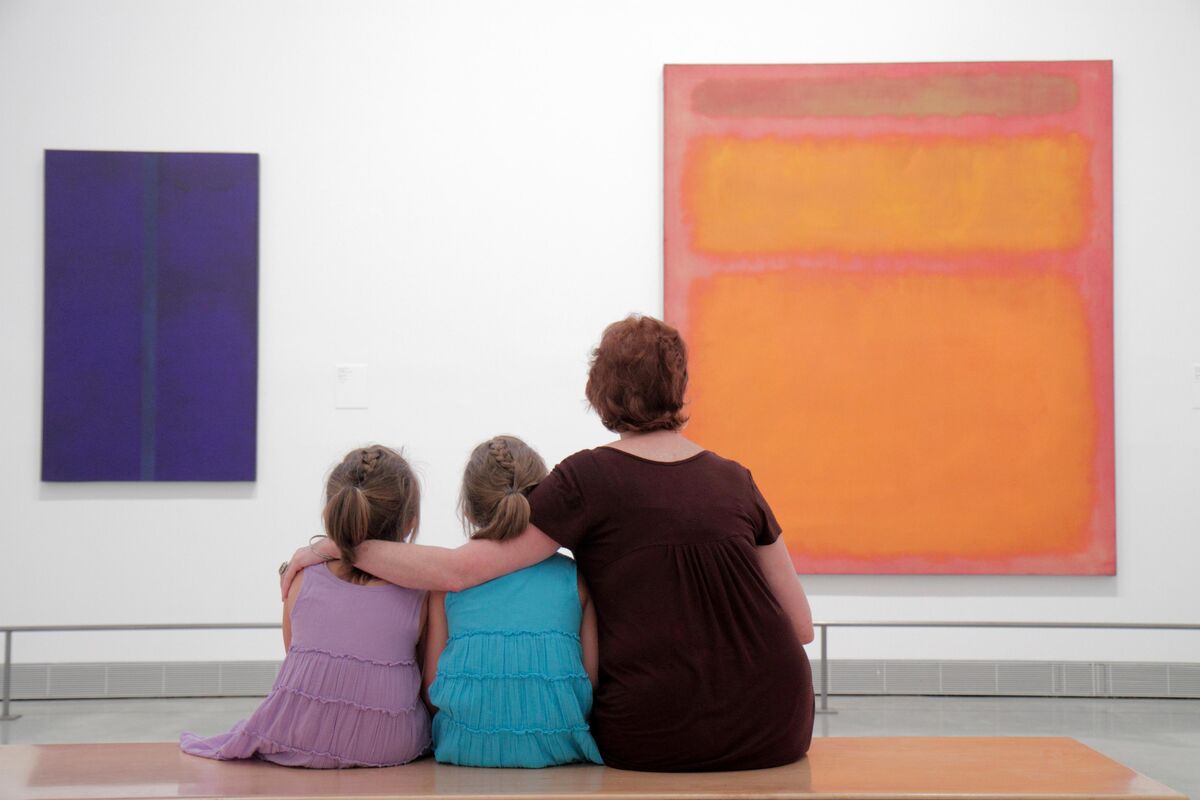 Photo by Jeffrey Greenberg/UIG via Getty Images.Two children looking at a Mark Rothko painting with an adult.