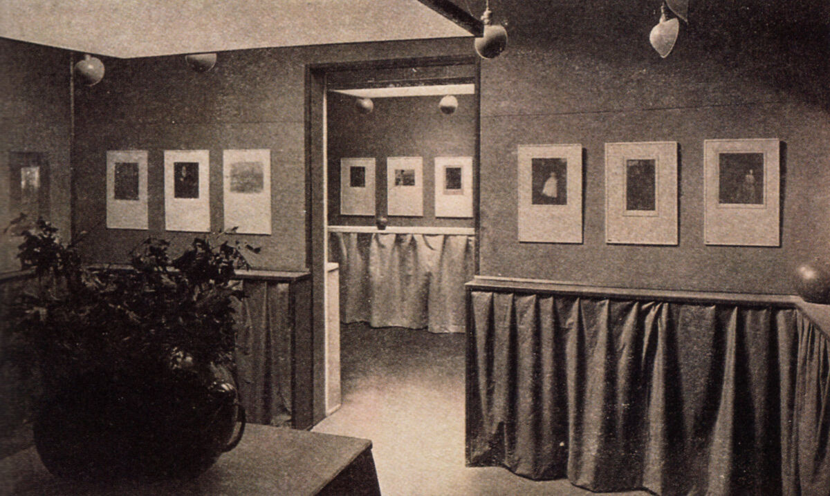 Photo of the Gertrude Käsebier and Clarence H. White exhibition at the Little Galleries of the Photo-Secession, February 1906. Image via Wikimedia Commons.
