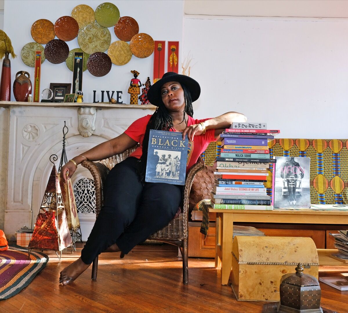Laylah Amatullah Barrayn with her photo book collection. Courtesy of Laylah Amatullah Barrayn.