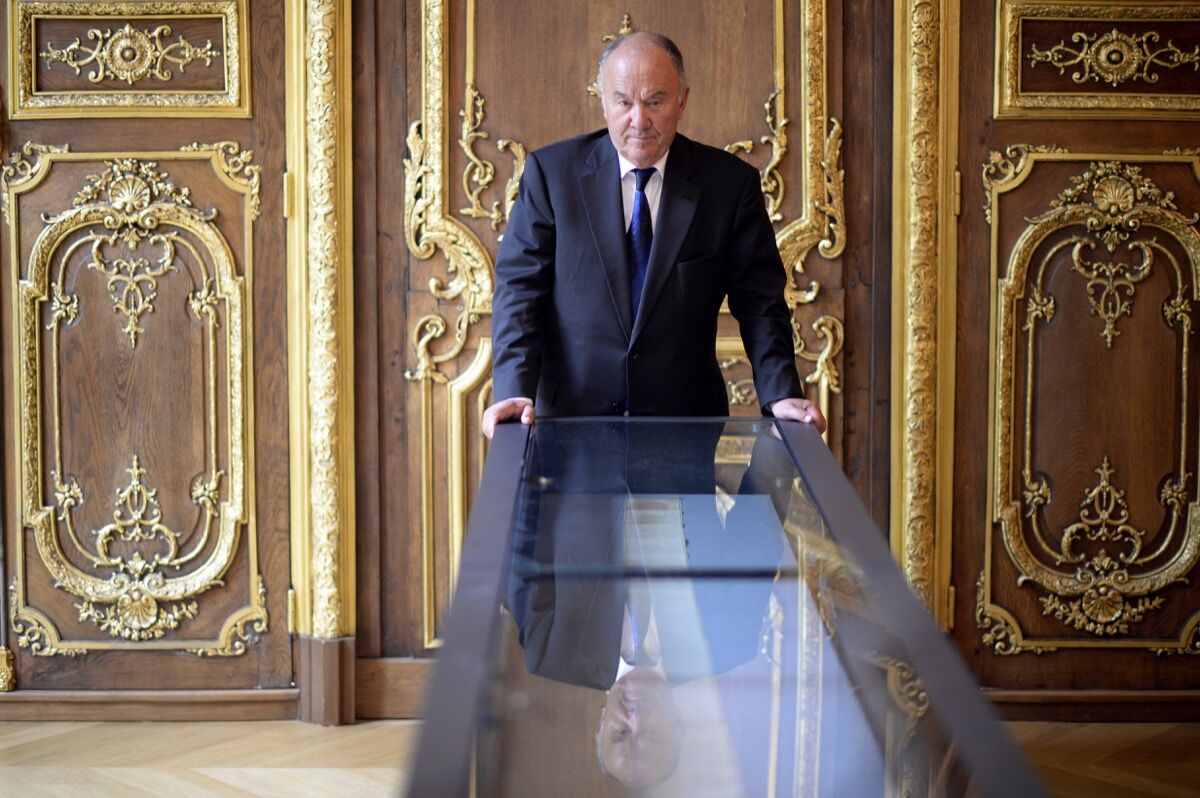 Gerard Lheritier with Marquis de Sade’s The 120 Days of Sodom, 2014. Photo by Martin Bureau/AFP/Getty Images.