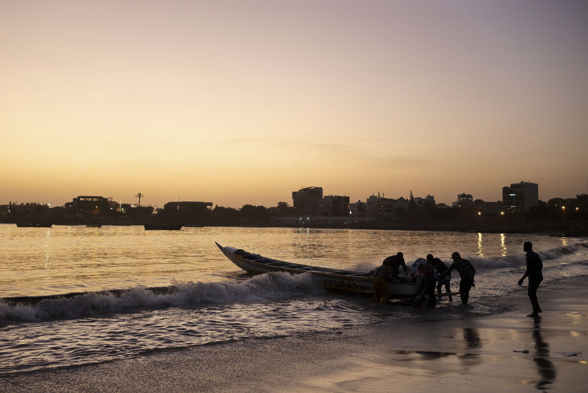 Fishermen pulling a boat up to Soumbedione Fish Market, Dakar, 2019. © Kehinde Wiley. Used by permission.