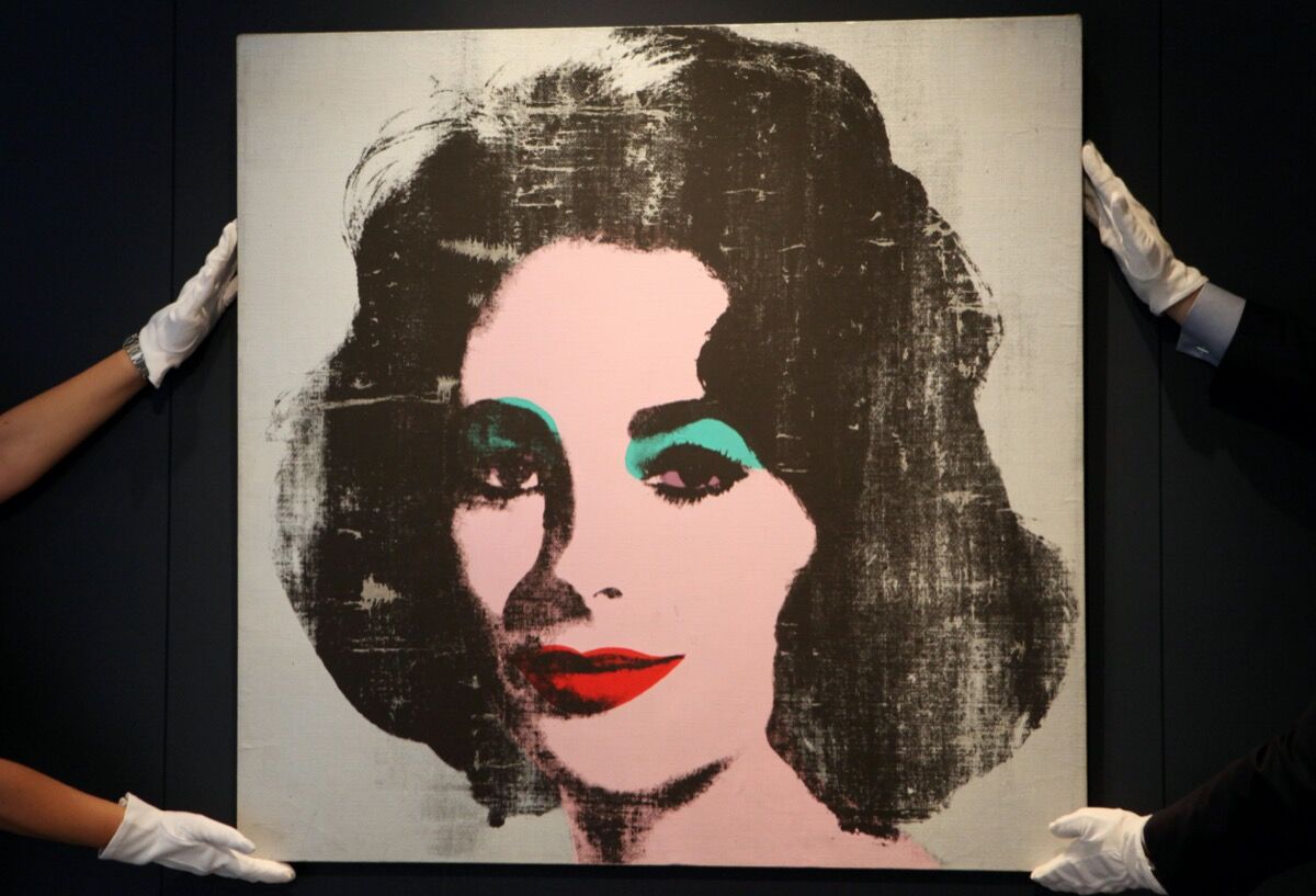 Andy Warhol, Silver Liz, 1963, went to auction as part of Christie’s Post War and Contemporary Art Evening sale in 2015. Photo by Katie Collins/PA Images via Getty Images.