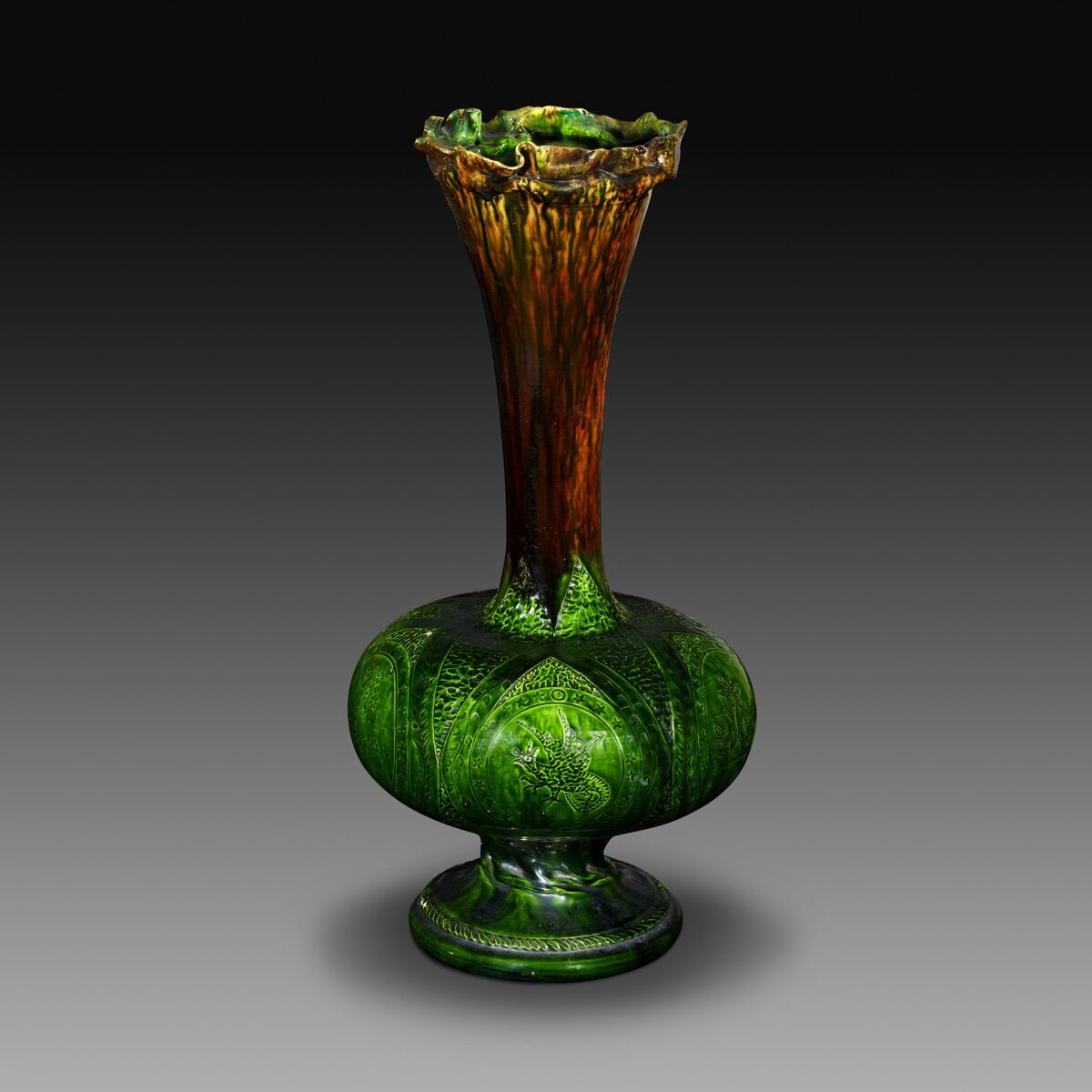 George Ohr, Tall dark green incised vase, 1895–c. 1900. Courtesy of the Collection of Marty and Estelle Shack. Photo by Phillip Ennis.