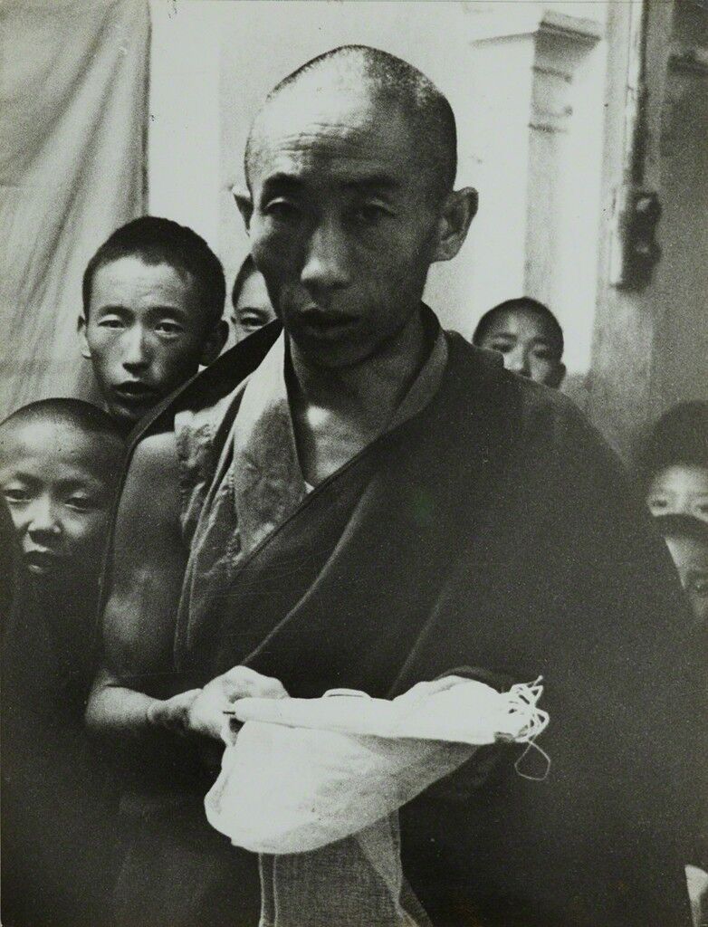 Tibetan religious ceremony offering of the white scarf