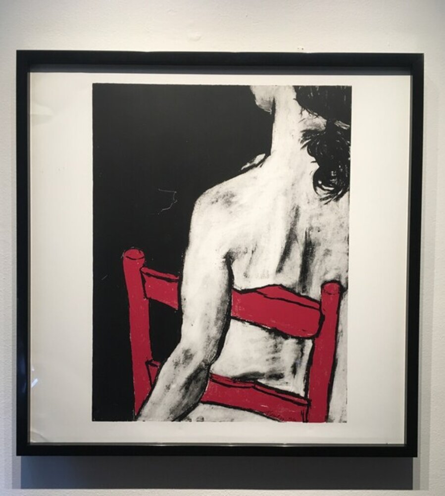 Girl Seated on Red Chair
