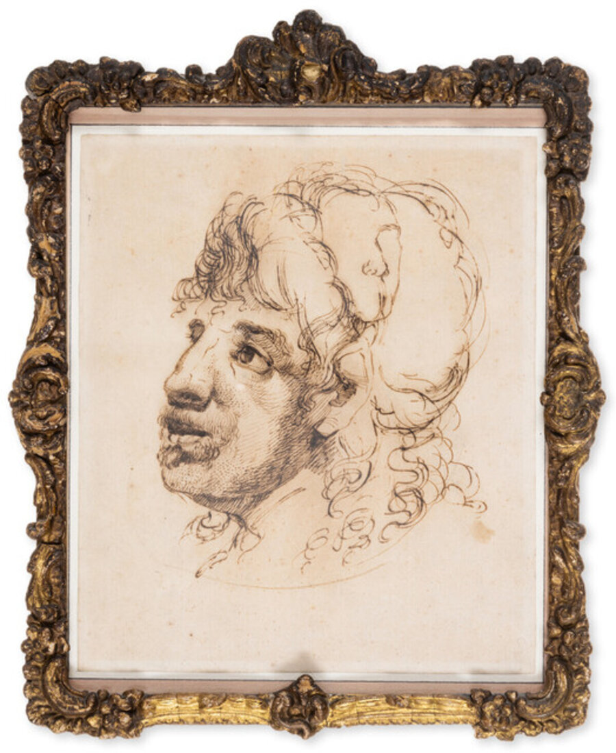 The head of a man with moustache and small beard