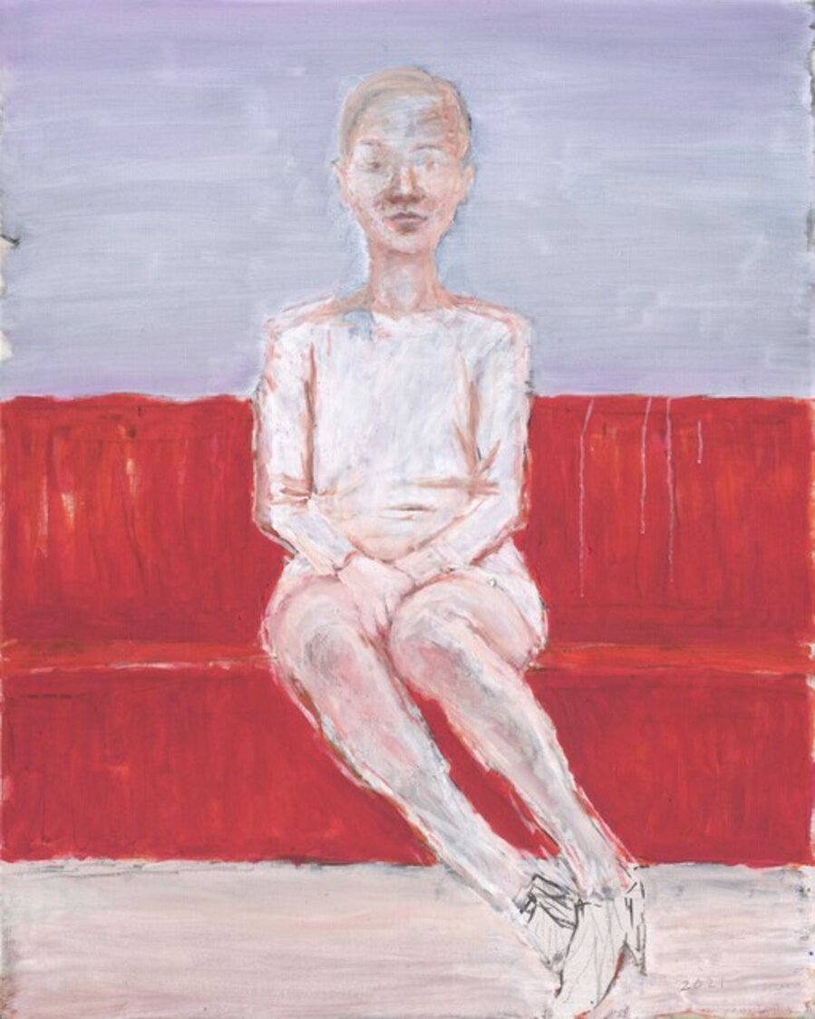 Woman Sitting On A Red Sofa