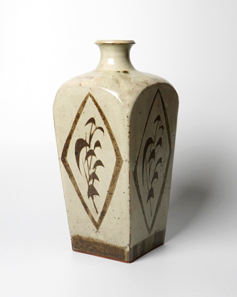 Jar with white slip and grass carvings