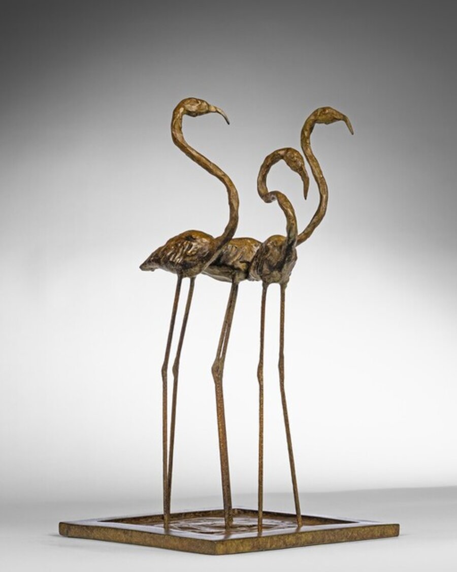 Three Flamingos Wading