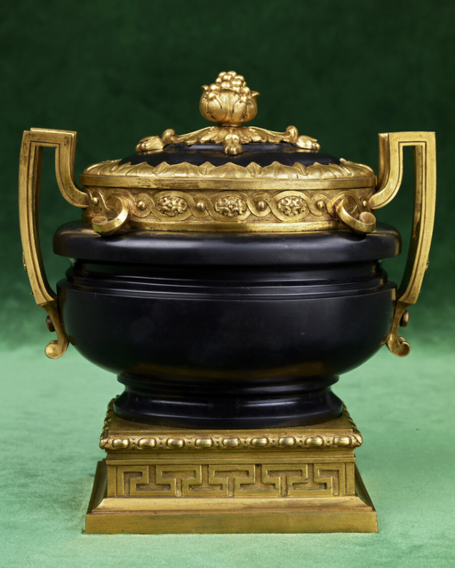 A nero antico marble gilt bronze mounted carvered urn formely in the of the Jacques Doucet collection and later in the Dukes of Albufera collection