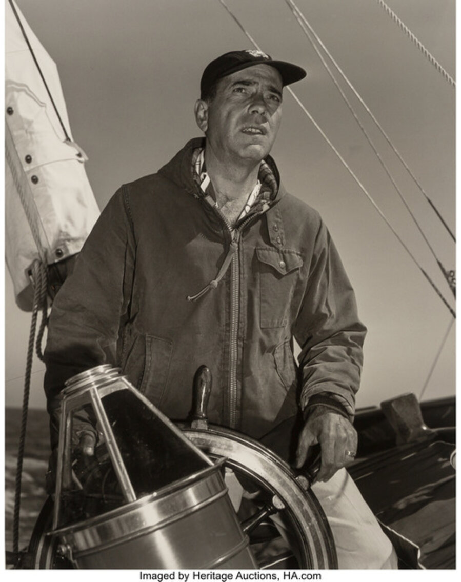 Humphrey Bogart at the Helm of His 55 Foot Yacht 'Santana'
