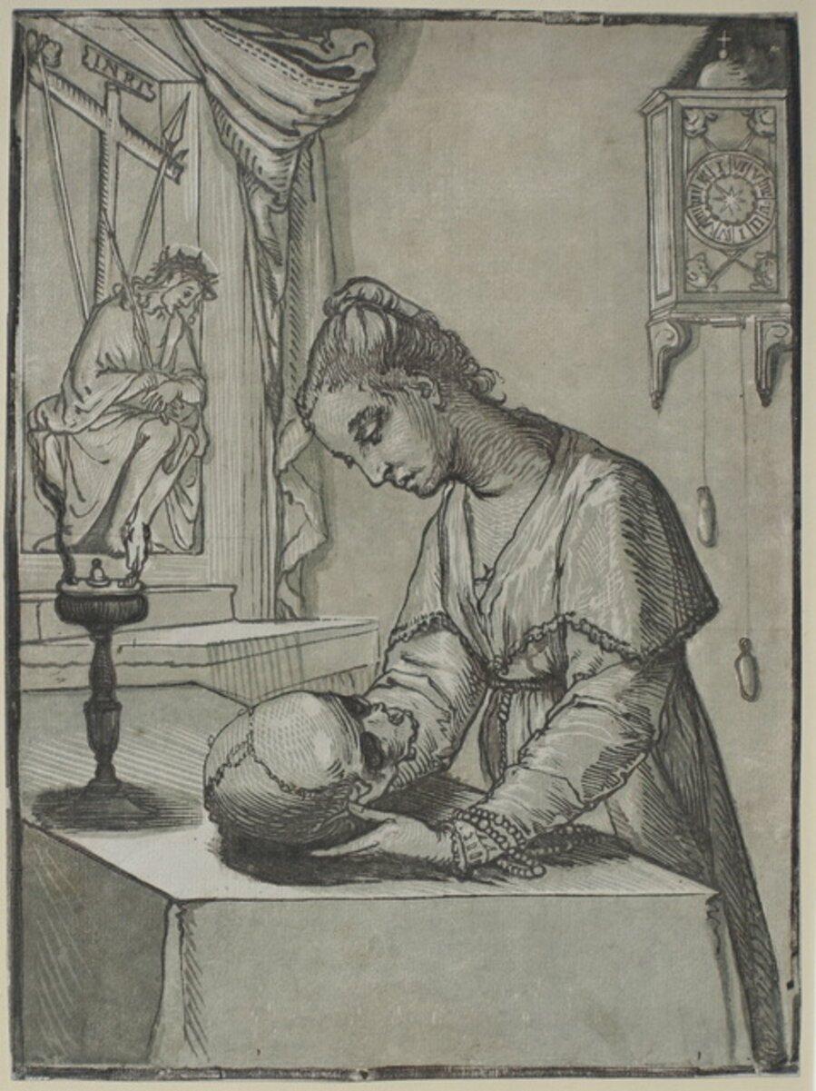 Woman contemplating a Skull