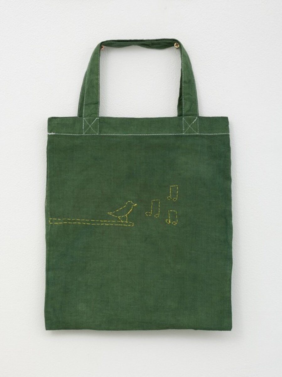 Green tote bag with bird on branch