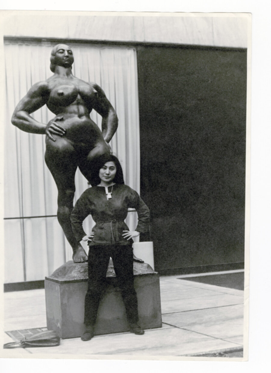 Yoko Ono with Standing Woman (1932) by Gaston Lachaise, The Museum of Modern Art Sculpture Garden, New York. c. 1960–61.