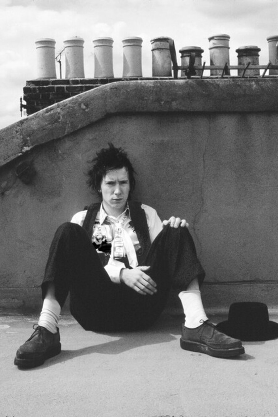 Johnny Rotten on his roof of his home, taking a break from recording tracks for his post-Sex Pistols band, Public Image Ltd (PIL). Warwick Road, London