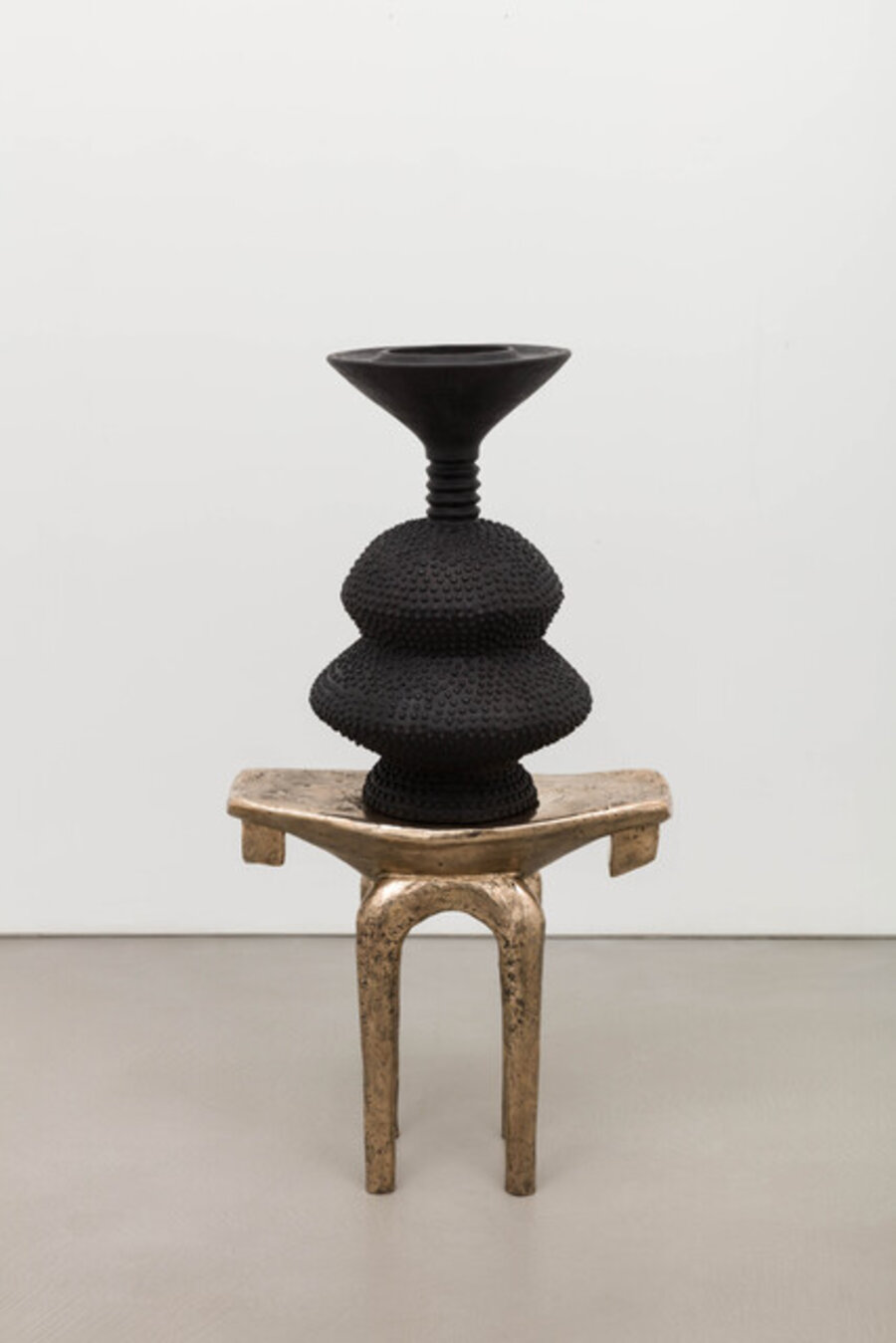 black eclipse on golden stool