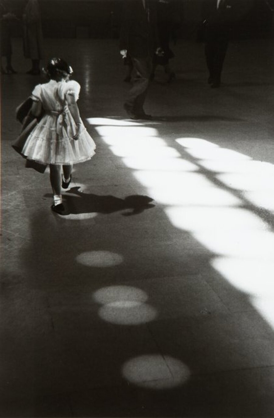 Young Girl Playing in Light Circles, Penn Station, New York City