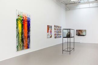 FADE IN: INT. ART GALLERY – DAY, installation view