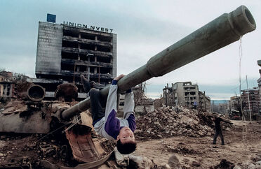 AFP, ‘A young boy plays on a tank in the Grbavica district of Sarajevo on April 22nd, 1996.’, 1996