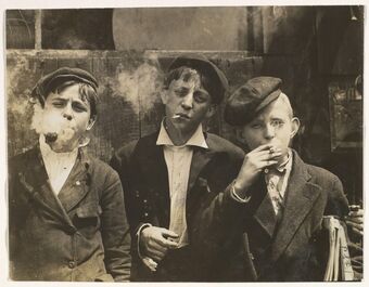 Lewis Wickes Hine, ‘11:00 A.M. Monday, May 9th, 1910. Newsies at Skeeter's Branch, Jefferson near Franklin. They were all smoking. Location: St. Louis, Missouri.’, Mon May 09 00:00:00 EST 1910