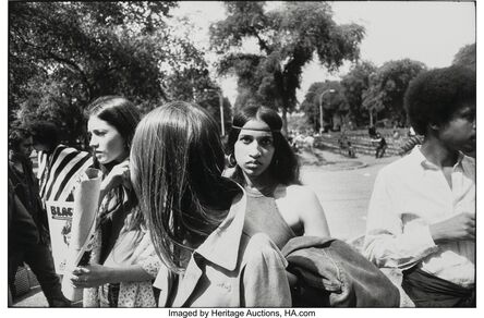 Garry Winogrand, ‘Woman in Group with Headband and Hoop Earrings in Park, from "Women are Beautiful"’, 1975