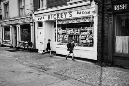 Edward Quinn, ‘Boys running past Hickey’s, Dublin’, 1963