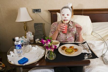 Lauren Greenfield, ‘Dr. Steven Teitelbaum’s forty-nine-year-old patient, who is recovering from a full-face laser resurfacing and an upper eye lift, eats lunch in a private room at Serenity, a luxury aftercare facility that offers private chefs, spa treatments, and twenty-four-hour nursing, Santa Monica, California’, 2006
