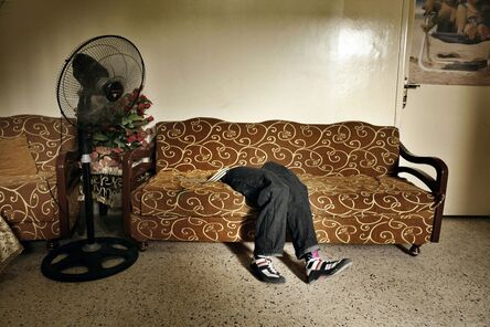 Laura Boushnak, ‘The prosthetic legs of Mohammed, lie on a sofa at the Rashidiyeh camp for Palestinian refugees. Rashidiyeh, Lebanon.’, 2007