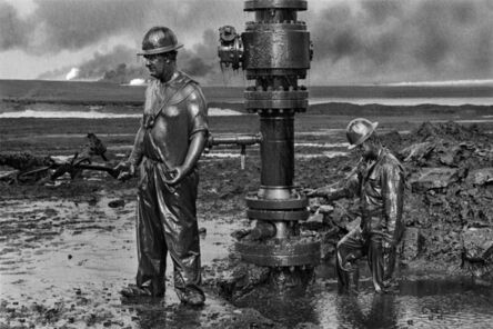 Sebastião Salgado, ‘Workers install the new wellhead to enable the injection of a chemical mud to „kill the old well.“, Oil wells, Greater Burhan, Kuwait’, 1991