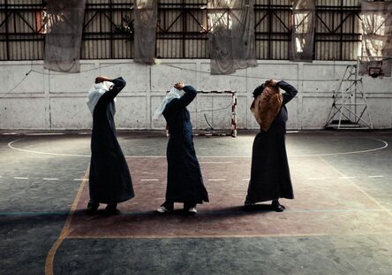 Tanya Habjouqa, ‘Young women, fully dressed in “jilbab,” exercise in a gym in Gaza. The women remain covered because they have no privacy in public’, 2009