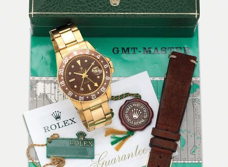 Rolex, ‘A fine and very rare yellow gold dual time wristwatch with center seconds, date, straight hands, engraved back, "nipple" dial, bracelet, guarantee and box’, Circa 1968