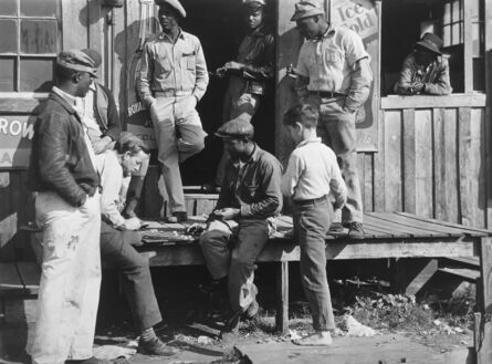 Marion Post Wolcott, ‘Migrants playing checkers (with bottle caps), on a juke joint porch after a “freeze-out” of vegetable crops. Near Okeechobee, Florida’, 1939