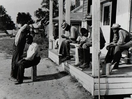 Marion Post Wolcott, ‘Haircutting in front of general store, Marcella Plantation, Mileston, Mississippi’, 1939