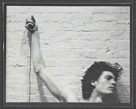 Robert Mapplethorpe, ‘Self-portrait of Robert Mapplethorpe with trip cable in hand’, 1974