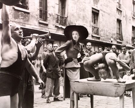 Richard Avedon, ‘Elise Daniels with Street Performers, Suit by Balenciaga, Le Marais, Paris, August’, 1948