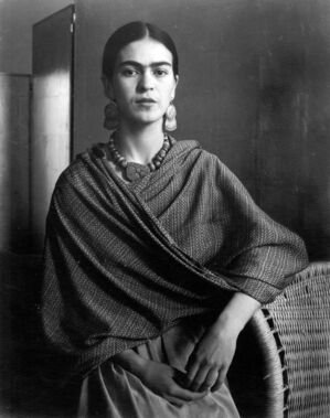 Frida Kahlo standing by basket