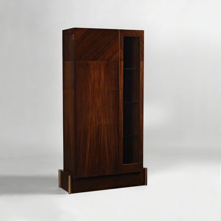 André Sornay, ‘Cabinet with full door on left and a glass door on right. Four bronze cylinders in corners.’, ca. 1929
