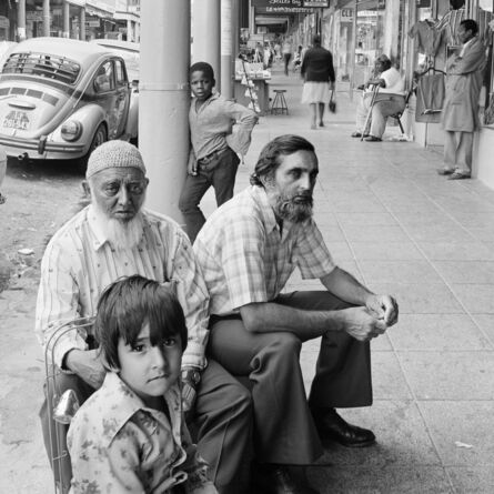 David Goldblatt, ‘Golam Mehmood Mia (left), Mehmood Mia (right), and Iqbal Abdullah on 14th Street, Fietas before the destruction of the businesses under the Group Areas Act. Jan 1976’, 1976