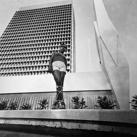 Paul Kodjo, ‘Photographie de mode réalisée devant l'immeuble de la caisse de stabilisation, Plateau, Abidjan’, 1970