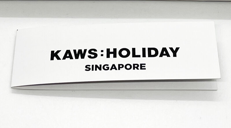 KAWS, ‘KAWS 'Singapore: Fan' (w/display)’, 2021, Ephemera or Merchandise, Collectible designer paper and bamboo sensu/fan engraved with KAWS:HOLIDAY and subtle "X" patterns on the paper. Includes custom clear acrylic display case with wood base, black suede platform and unique acrylic fan holder., Signari Gallery