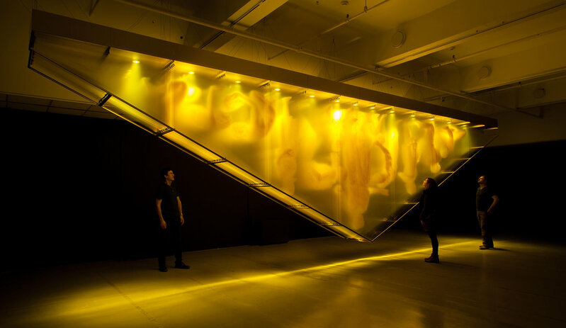 David Spriggs, ‘Stratachrome Gold’, 2017, Installation, Yellow acrylic paint on layered sheets of transparent film, triangular gold colour structure, lighting units., Unit 