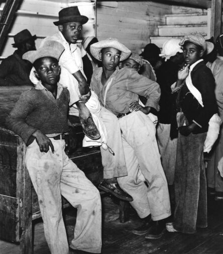 Marion Post Wolcott, ‘Young men waiting to be paid for picking cotton, inside plantation store, Marcella Plantation, Milestone, Mississippi’, 1939